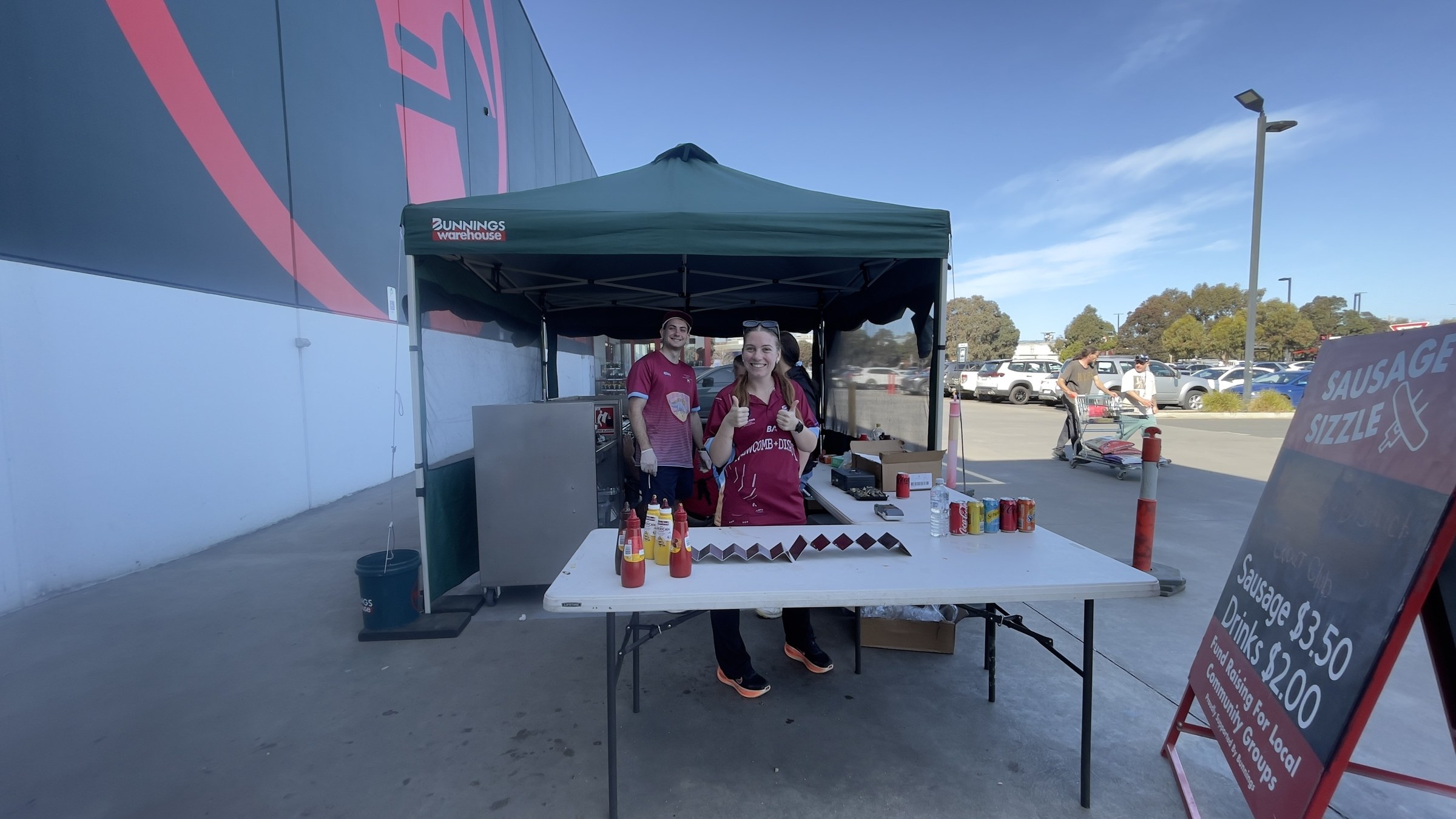 NDCC volunteers behind the sausage-sizzle table outside Bunnings Leopold.