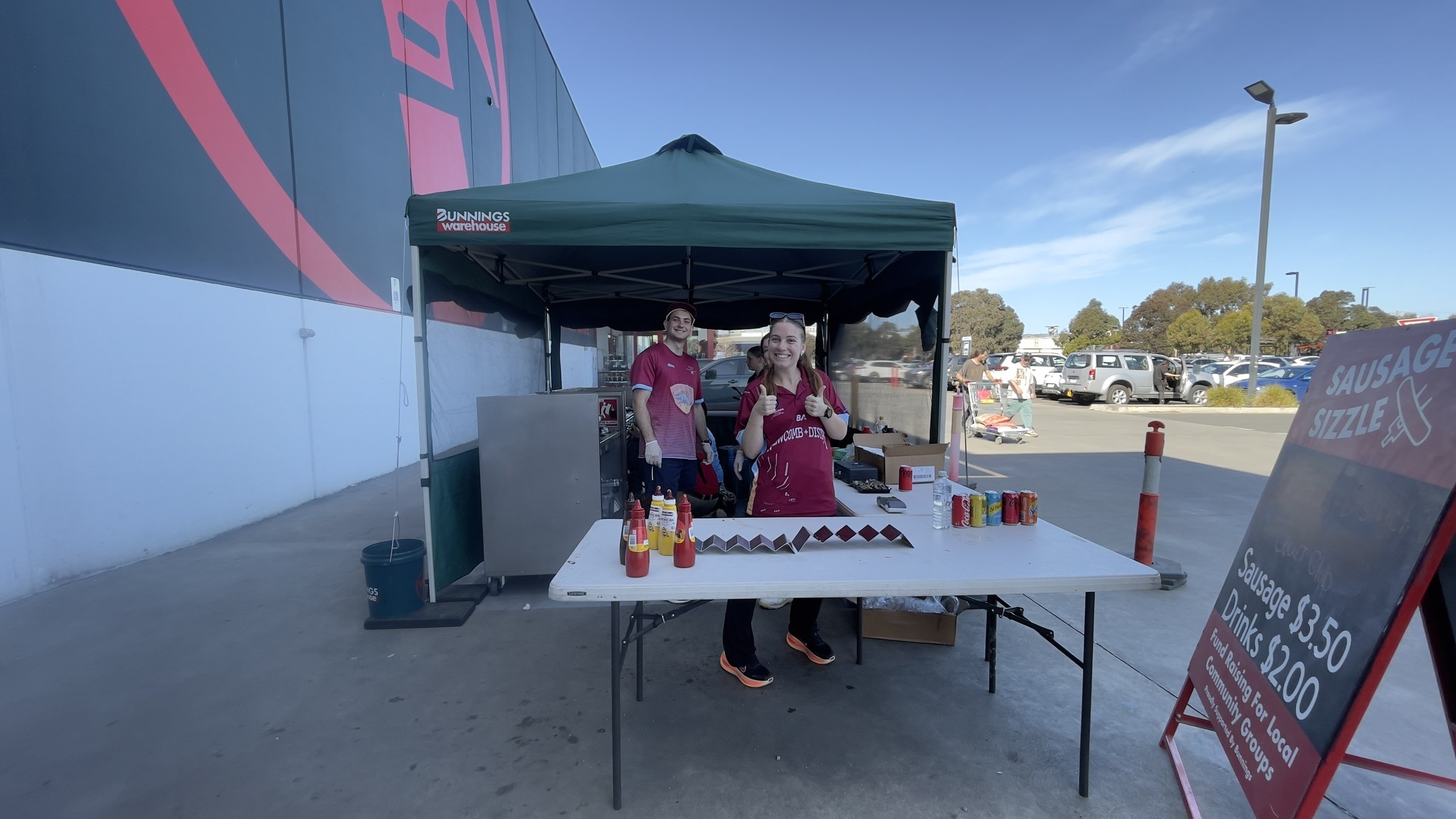 NDCC volunteers behind the sausage-sizzle table outside Bunnings Leopold.
