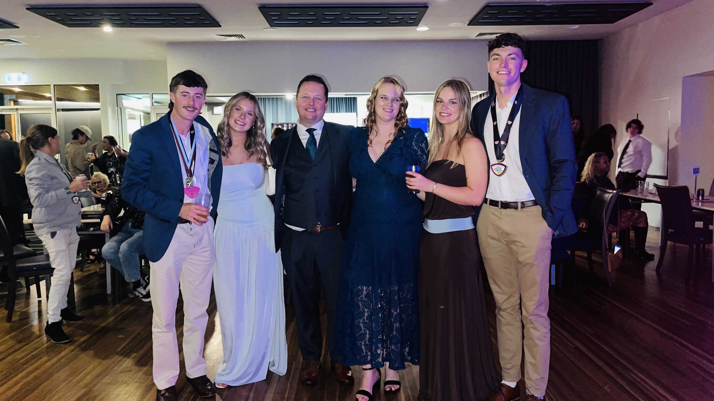 Club members and guests posing for a group photograph at presentation night.